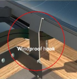A close-up diagram showing a metal windproof hook securely clamping the edge of a solar roof tile to a structural batten, demonstrating the system's resistance to wind uplift.