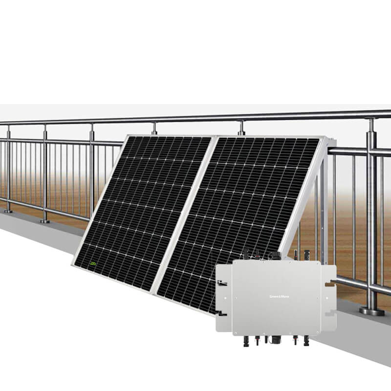 A complete plug-and-play balcony solar system kit featuring two monocrystalline solar panels mounted with triangular brackets on a stainless steel balcony railing, shown with a smart solar microinverter in the foreground.