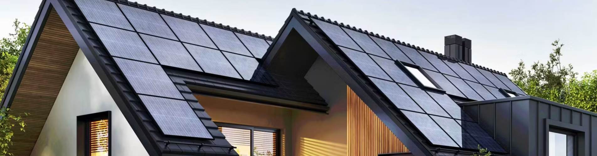 This wide-format, angled photograph showcases the detailed details of a multi-sloped roof in a modern high-end villa, featuring a Building Integrated Photovoltaic (BIPV) roof system. The main subject is a modern, minimalist geometrically designed residenc