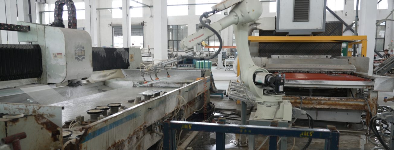 A real-life view of GreenMore's automated photovoltaic tile production line factory, showcasing a high-precision intelligent manufacturing workshop equipped with industrial robotic arms.
