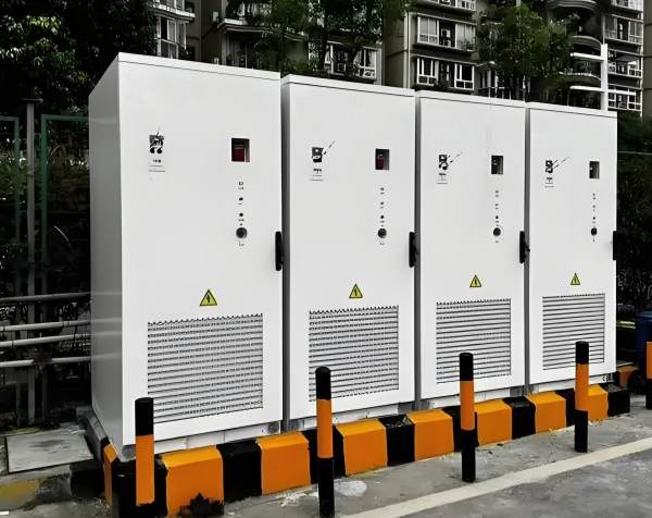 Energy storage control cabinets installed side-by-side with commercial and industrial solar power systems in GreenMore's outdoor communities.