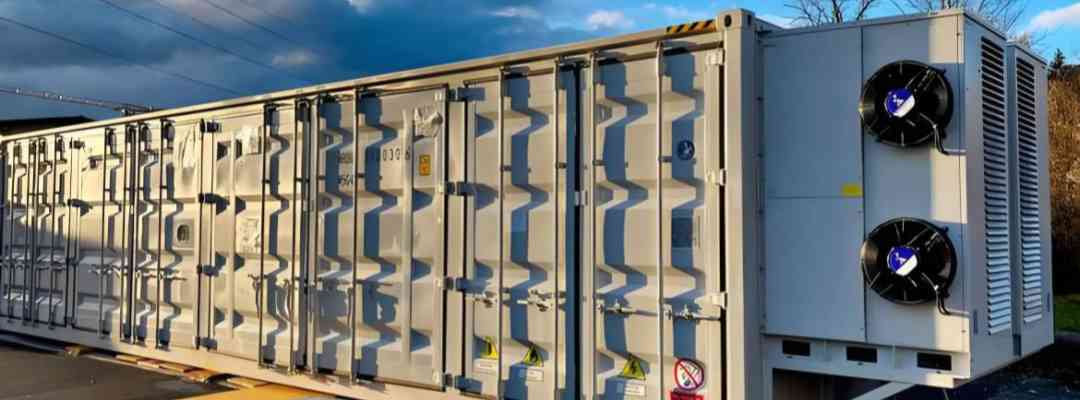 Real-world image of GreenMore's large-scale containerized energy storage system equipped with industrial-grade thermal control units for outdoor deployment.