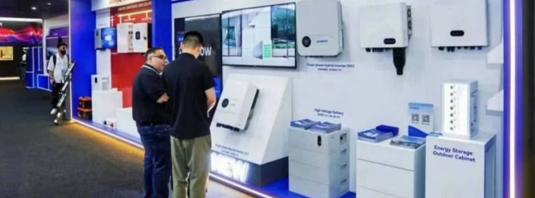 GreenMore booth at the 137th Canton Fair showing inverters, batteries and outdoor cabinet