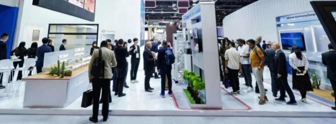 GreenMore exhibition booth at WFES 2026 &mdash; visitors and business delegates gathering at the booth in the Abu Dhabi National Exhibition Centre hall