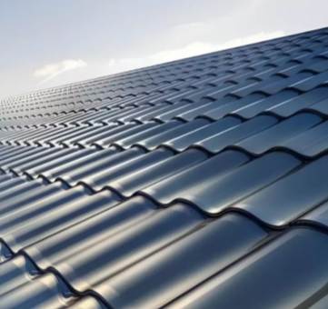 Real-life image of GreenMore residential rooftops featuring extensive BIPV curved solar tiles.