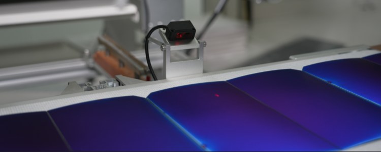 Real-life image of GreenMore solar tiles' 100% EL microcrack detection and online quality inspection station.